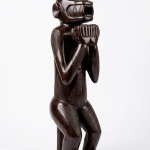 ebony stained hand carved seated primate